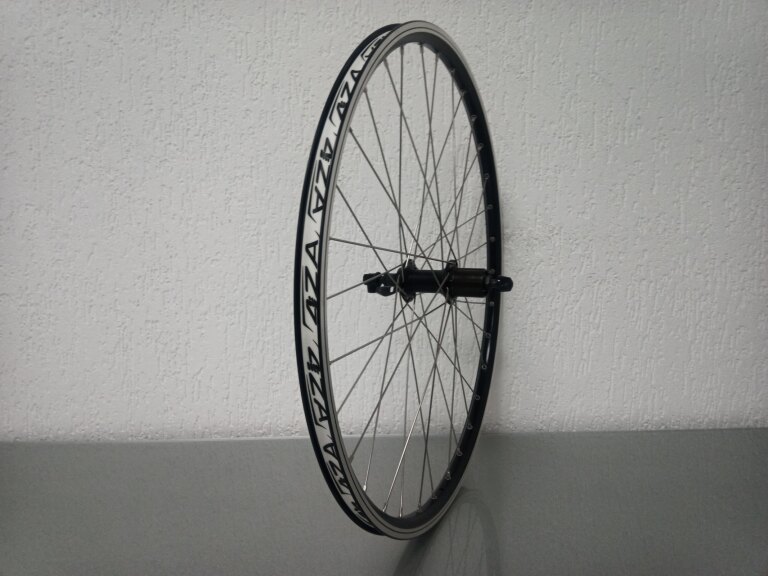 Rear wheel / 559X19C / Rigida - Ryde / ZAC 2000 / Black / Shimano / FH-T4000 Alivio / HG Body 35 MM / 135 MM / Rim brake / MTB - Tour