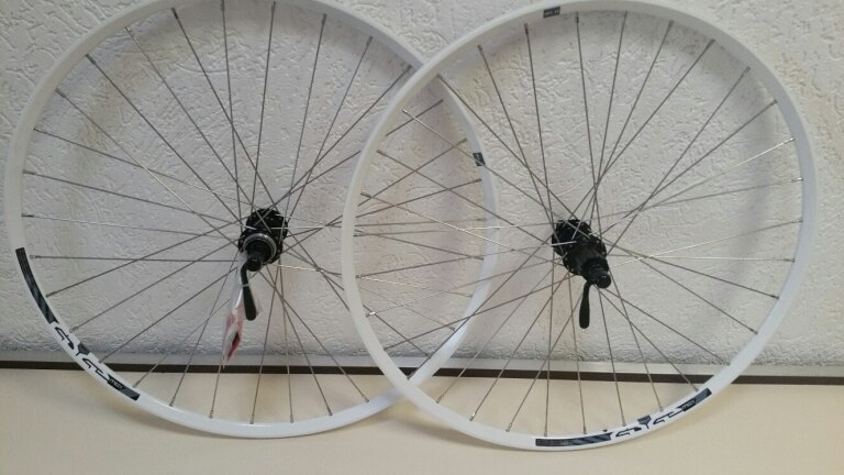 Paire de roues / 584X21C / Rigida - Ryde / Edge 7 / Blanc / Shimano / FH-RM66 & HB-RM65 / HG Body 35 MM / 135 MM / Disc (Centerlock) / VTT - Tour