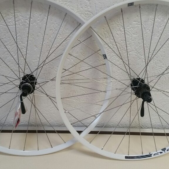 Wheelset / 584X21C / Rigida - Ryde / Edge 7 / White / Shimano / FH-RM66 & HB-RM65 / HG Body 35 MM  / 135 MM / Disc (Centerlock) / MTB - Tour 